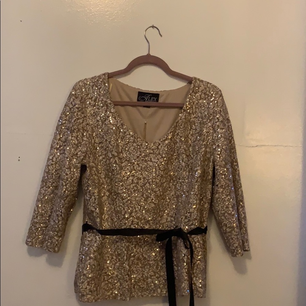 A sequin gold blouse